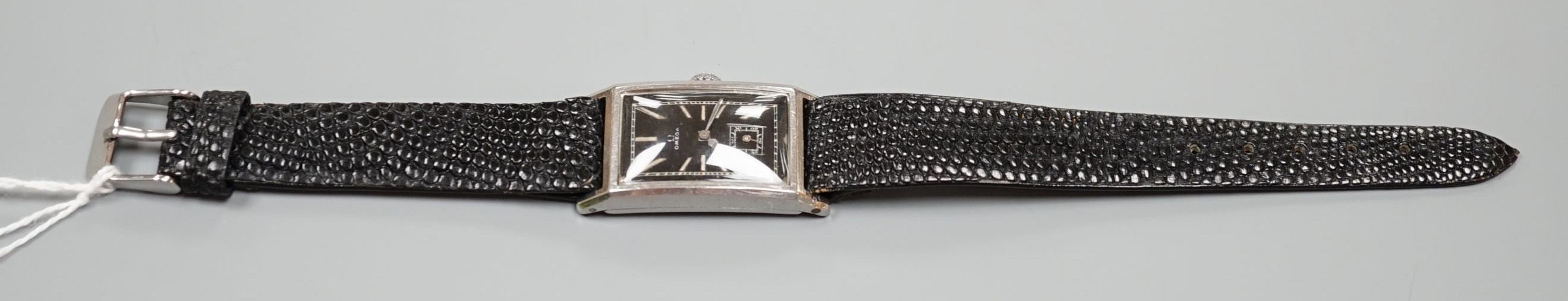 A gentleman's late 1930's stainless steel Omega rectangular black dial manual wind wrist watch, with subsidiary seconds, case diameter 24mm, on later strap.